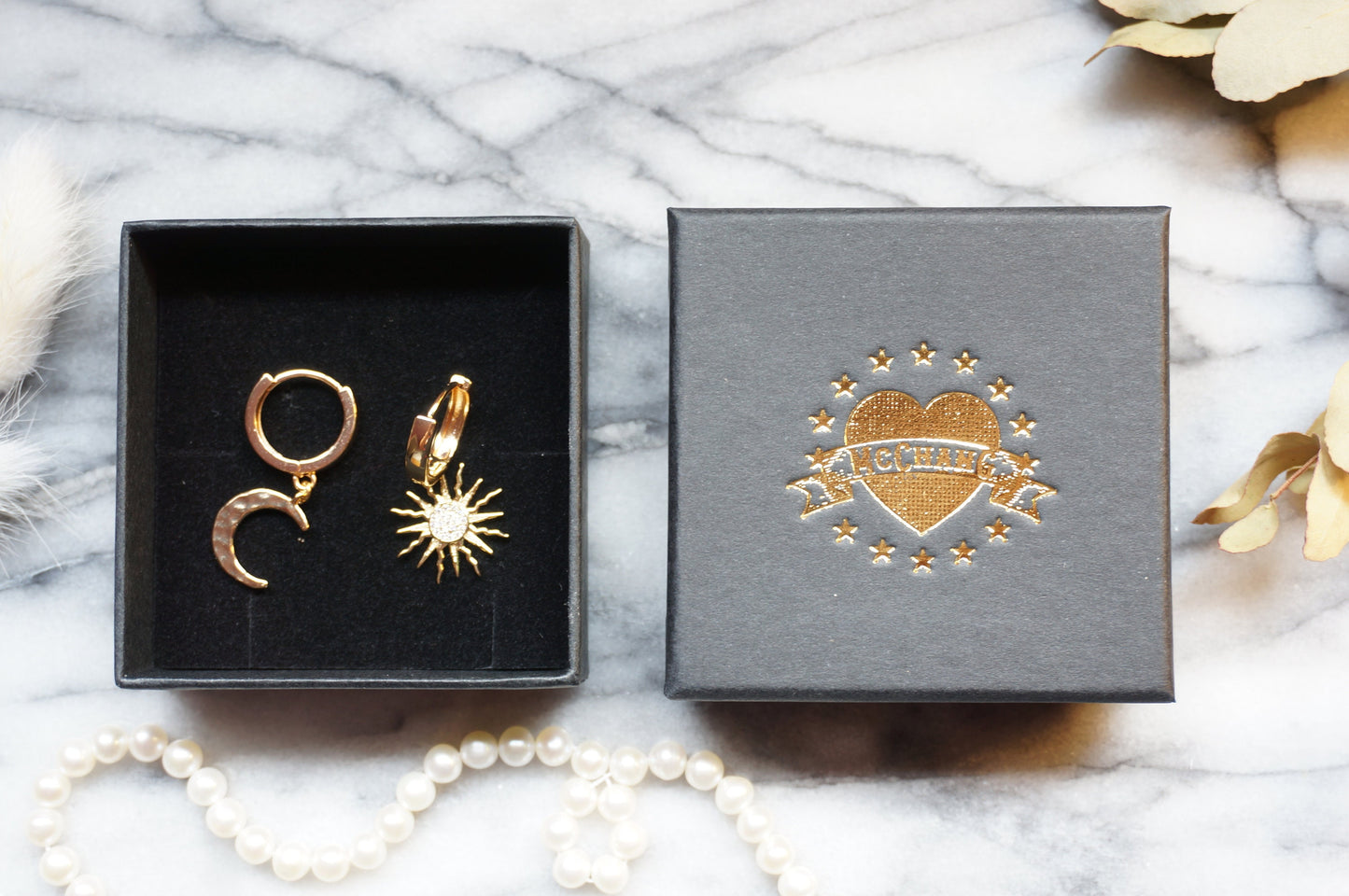 SOLSTICE Sun and Moon Mismatched Thick Gold Huggie Hoop Earrings in Gold/Silver