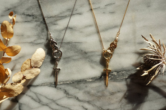THE HAND Gold / Silver / Black hand and sword necklace / Gold / Silver / Black sword statement necklace