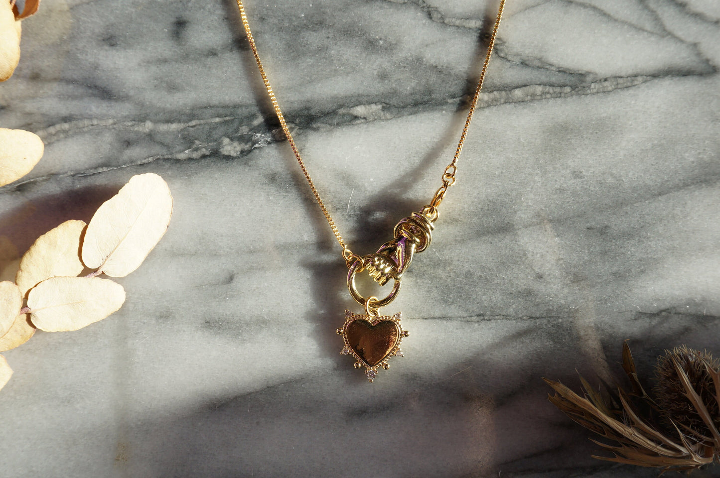 Hand holding Heart Gold / Silver Necklace