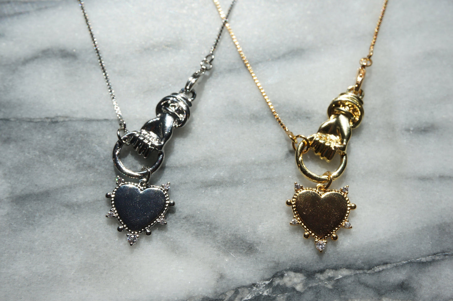 Hand holding Heart Gold / Silver Necklace