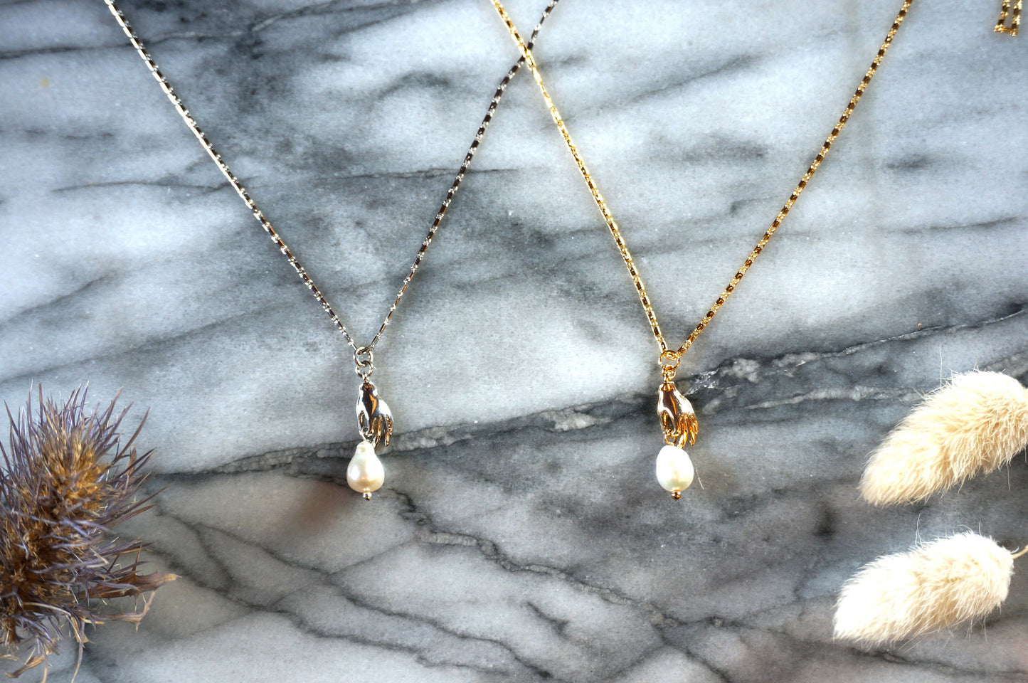 Hand holding pearl-drop necklace / Teardrop Pearl and hands dainty necklace