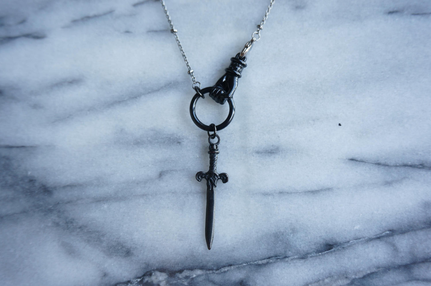THE HAND Gold / Silver / Black hand and sword necklace / Gold / Silver / Black sword statement necklace
