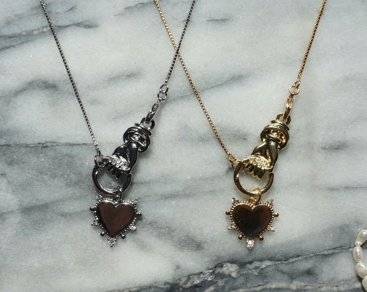 Hand holding Heart Gold / Silver Necklace