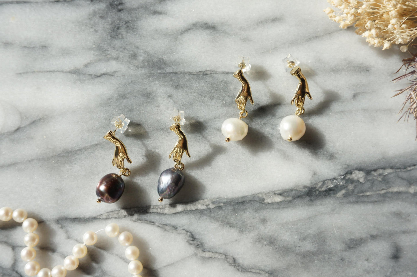 HAND HOLDING baroque Pearl 18k gold plated STUD earrings / white and black pearl earrings