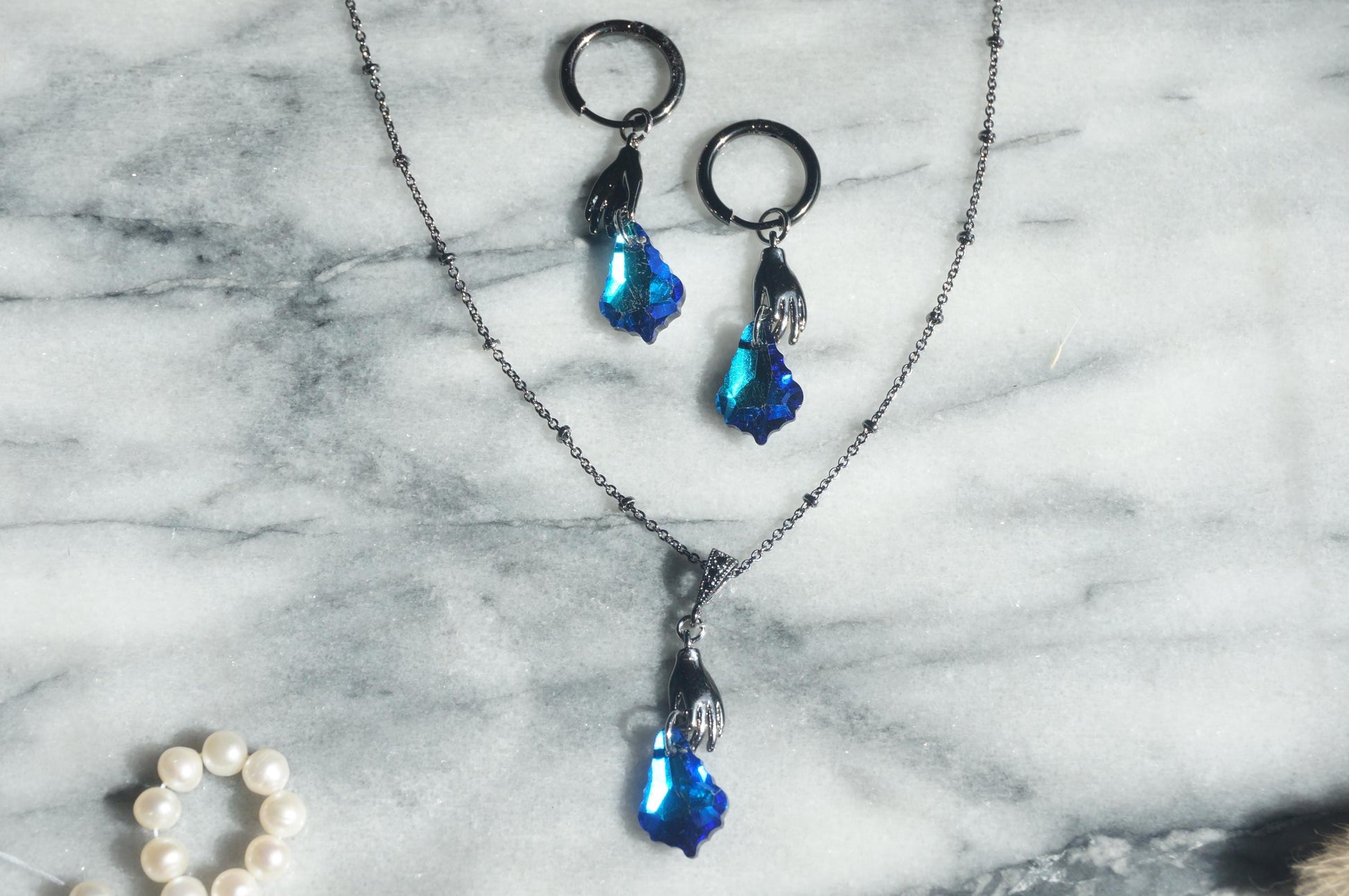 Azure HAND HOLDING blue crystal necklace and earrings