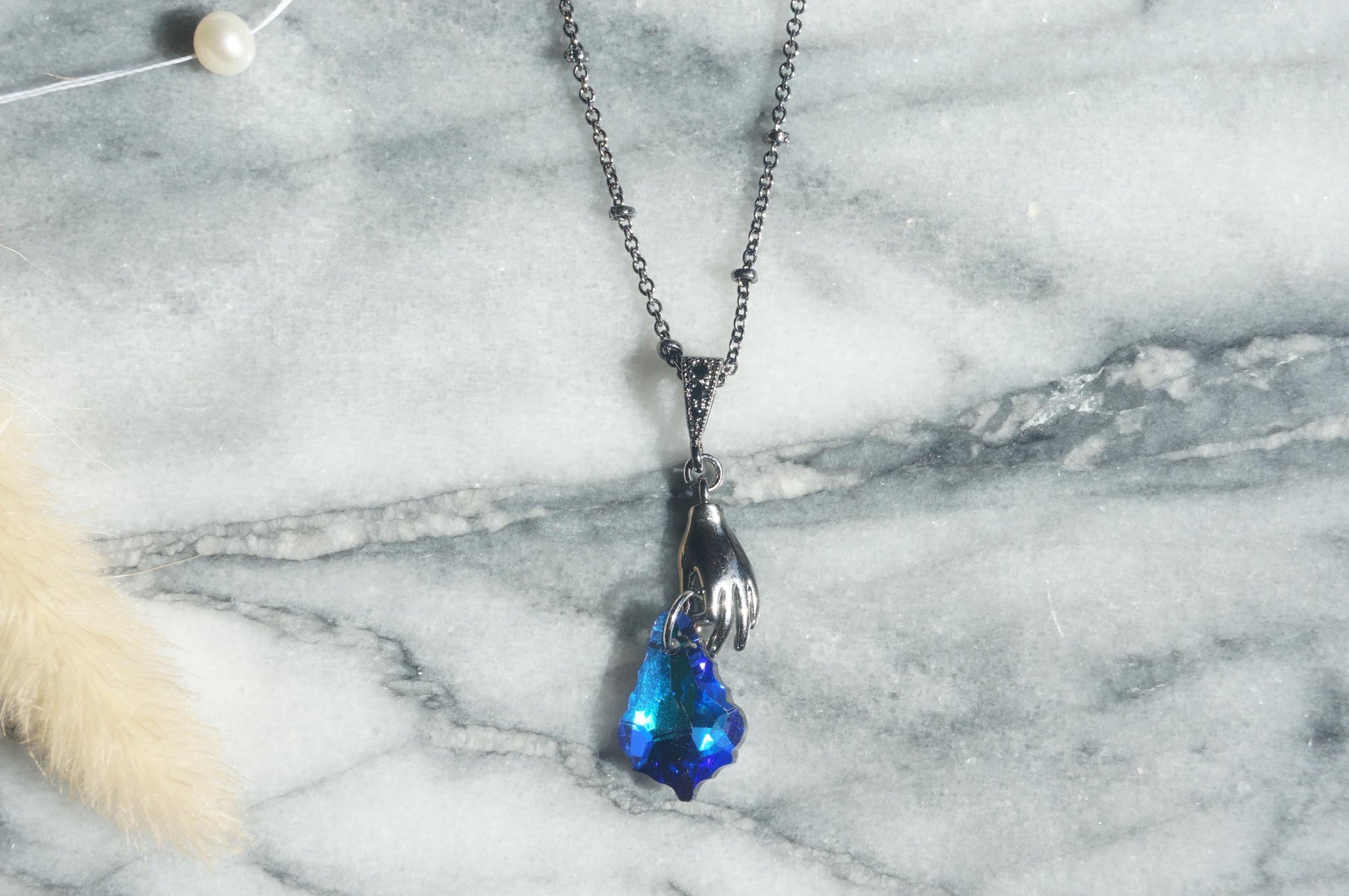 Azure HAND HOLDING blue crystal necklace and earrings