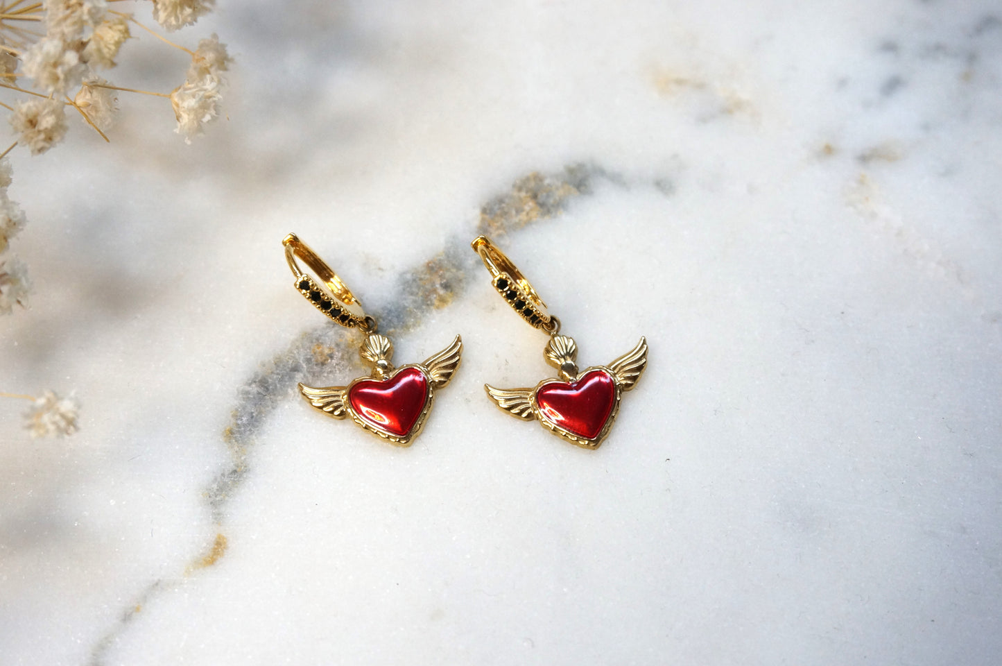 Winged sacred heart black studded hoops