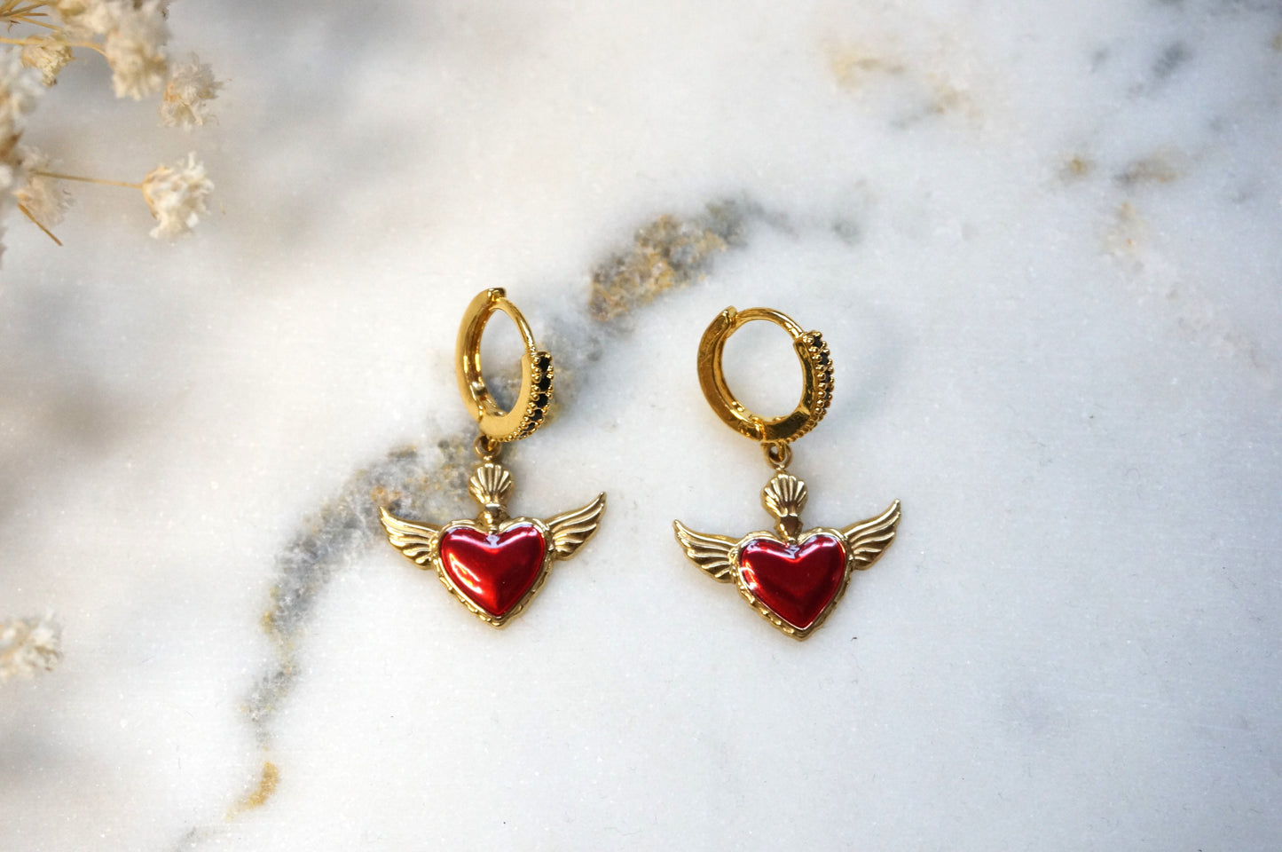 Winged sacred heart black studded hoops