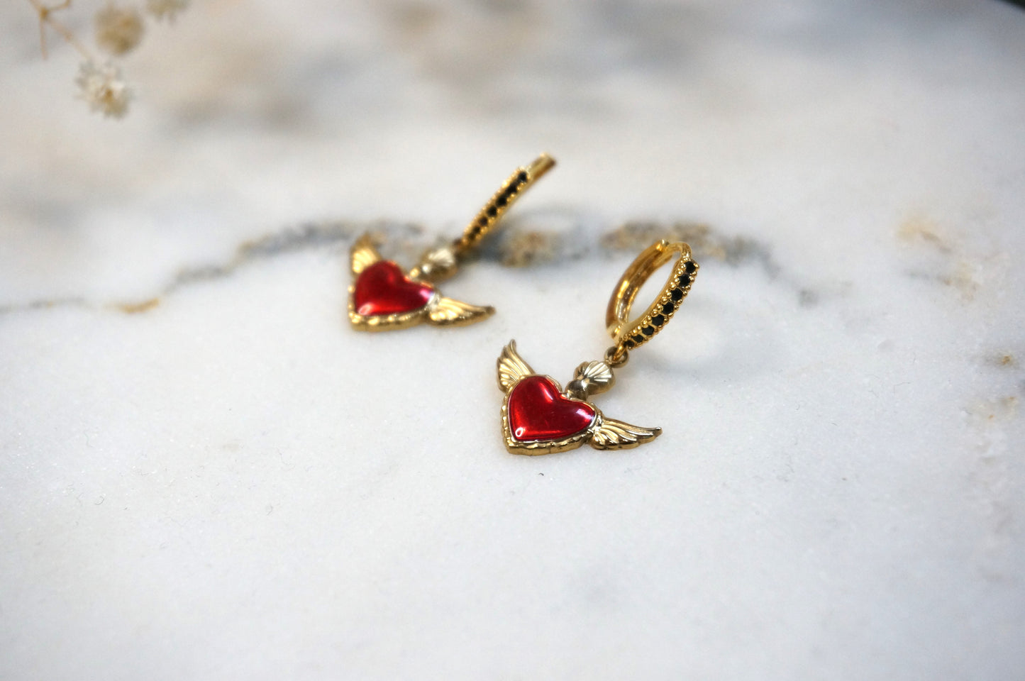 Winged sacred heart black studded hoops