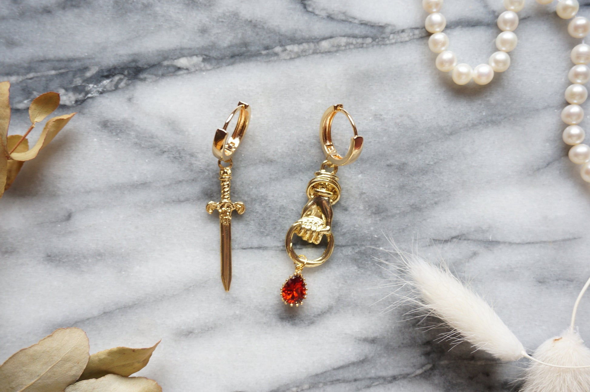 THE HAND Gold Sword and Teardrop Mismatched Huggie Earrings / Red Teardrop Earrings