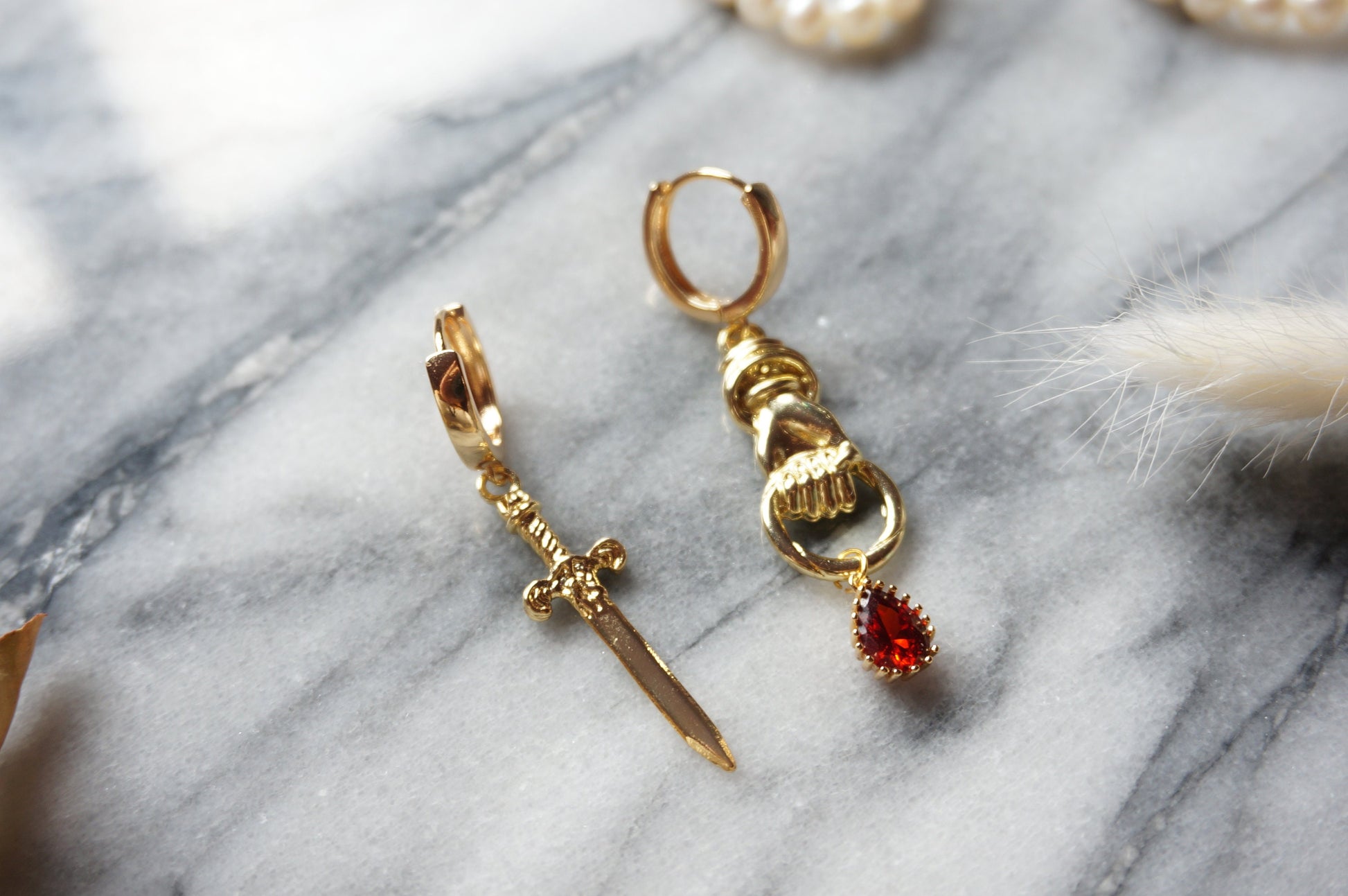 THE HAND Gold Sword and Teardrop Mismatched Huggie Earrings / Red Teardrop Earrings