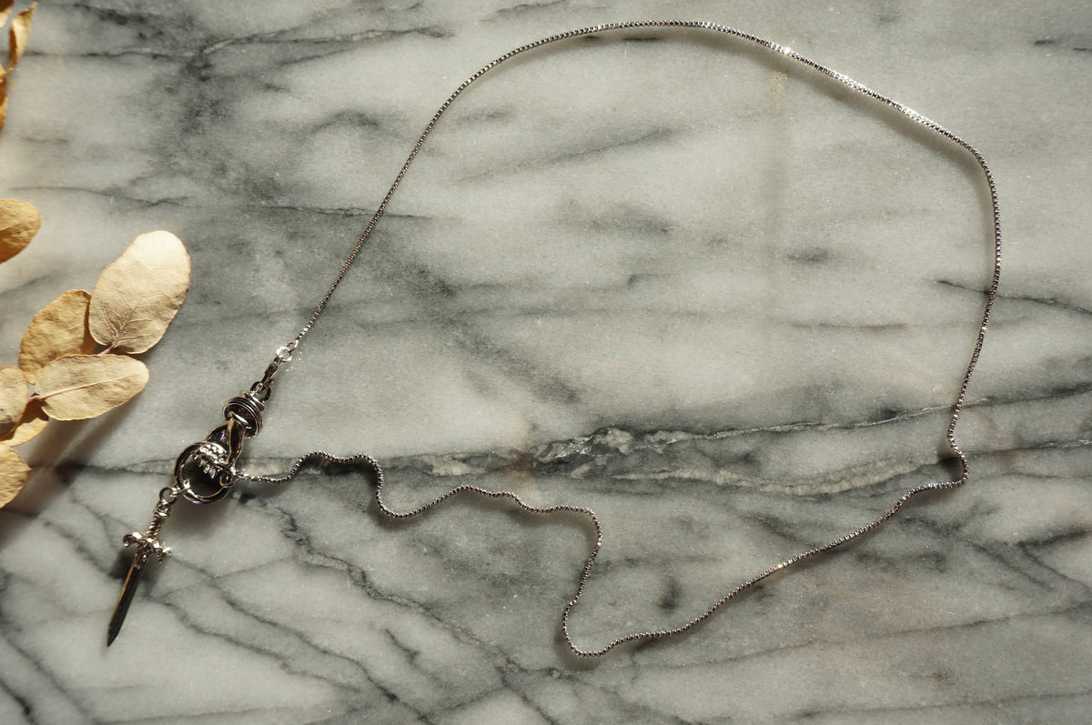 THE HAND Hand Holding Sword Necklace: Gold, Silver, Black Plated Brass Statement Pendant