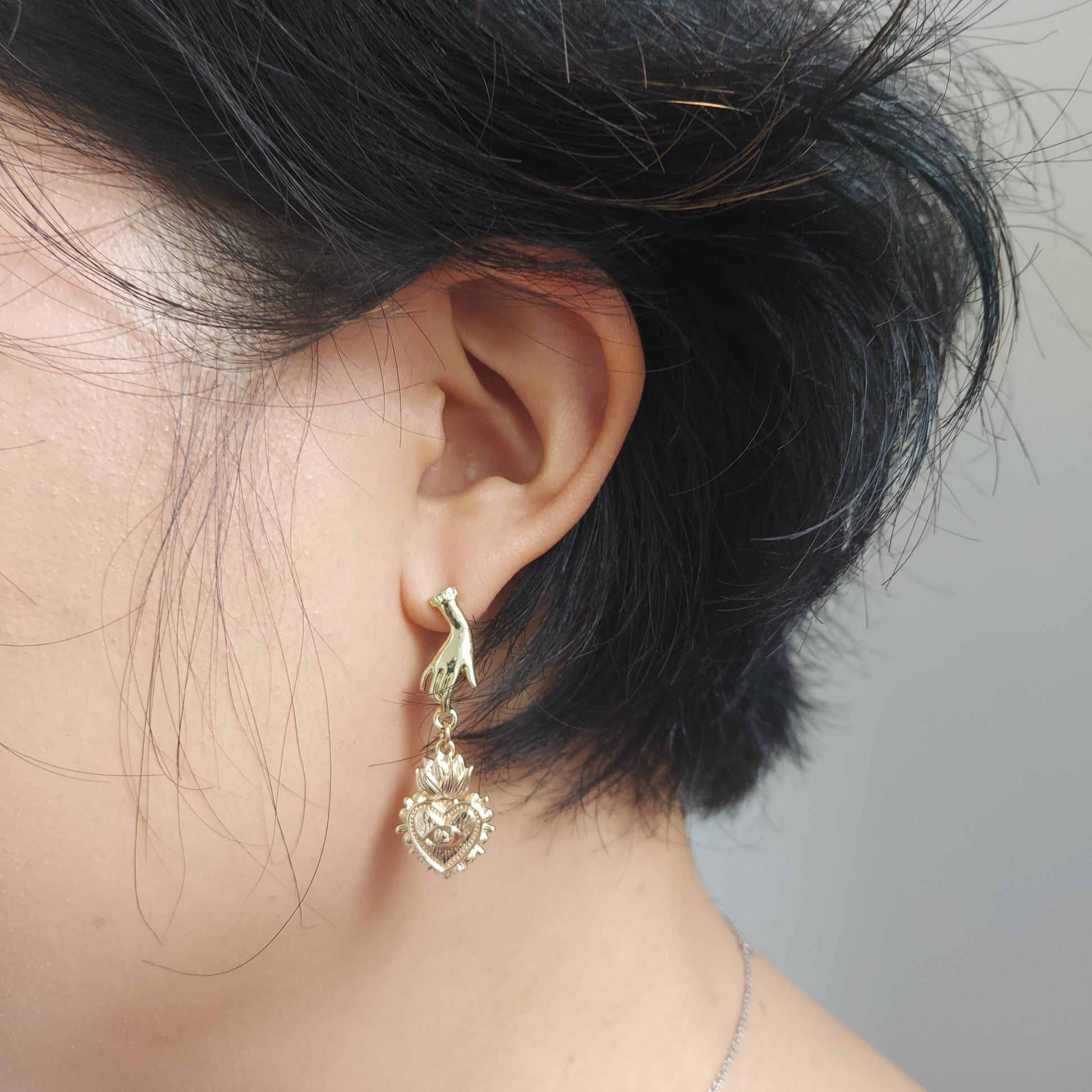 Hand Holding Sacred Heart with Evil Eye Gold Earrings