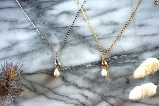Hand holding pearl-drop necklace / Teardrop Pearl and hands dainty necklace