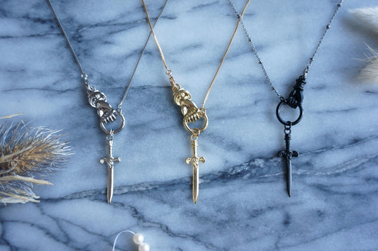 THE HAND Gold / Silver / Black hand and sword necklace / Gold / Silver / Black sword statement necklace