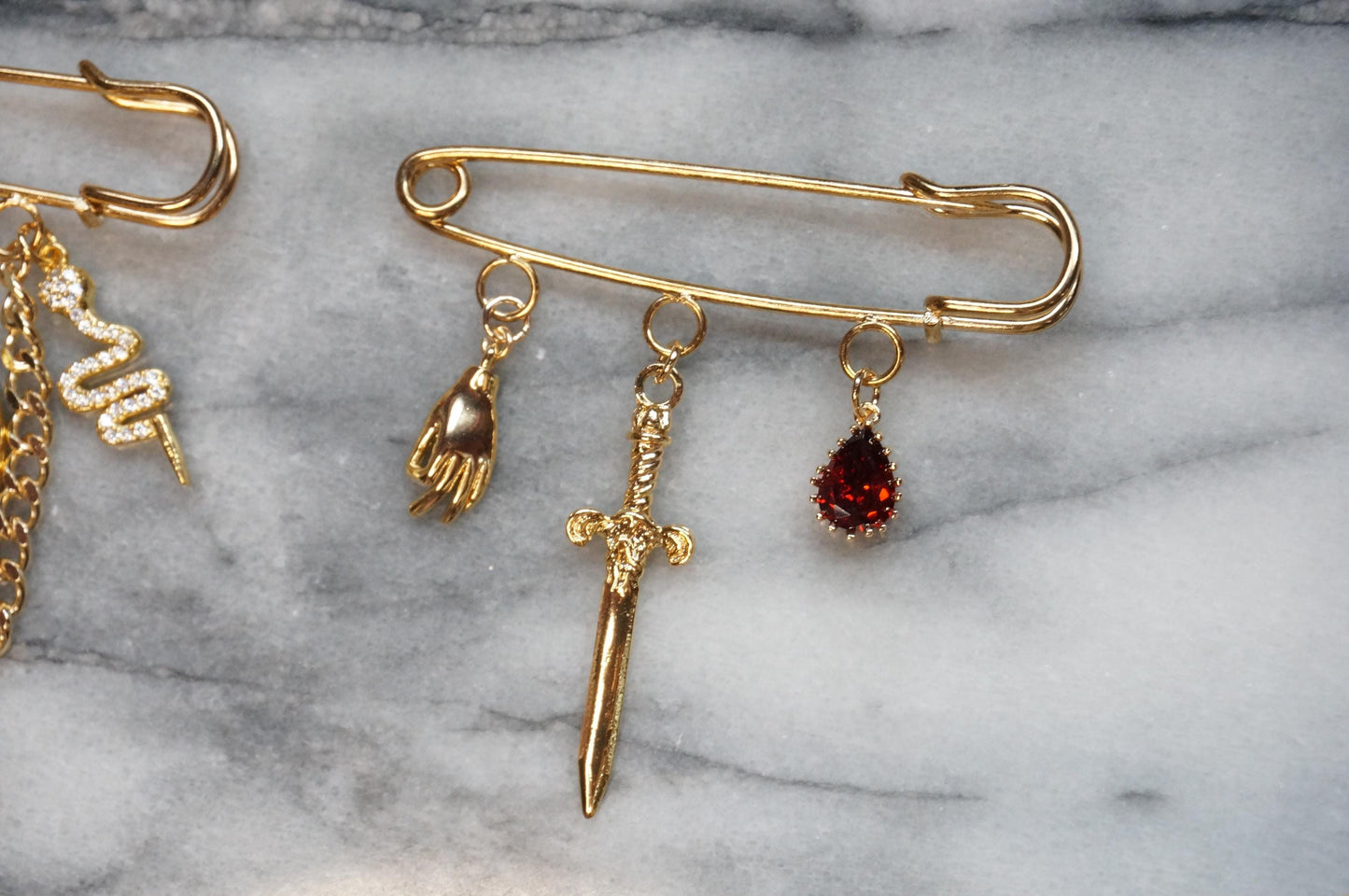 Oversized safety pin Lion / Sword / Cross