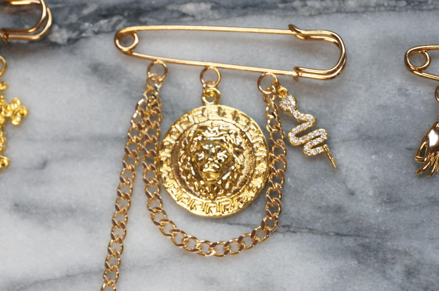 Oversized safety pin Lion / Sword / Cross