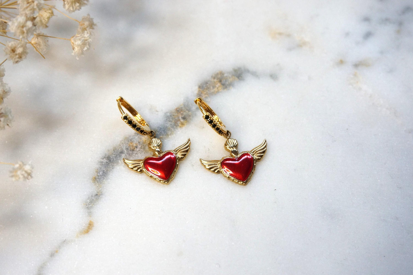 Winged sacred heart black studded hoops