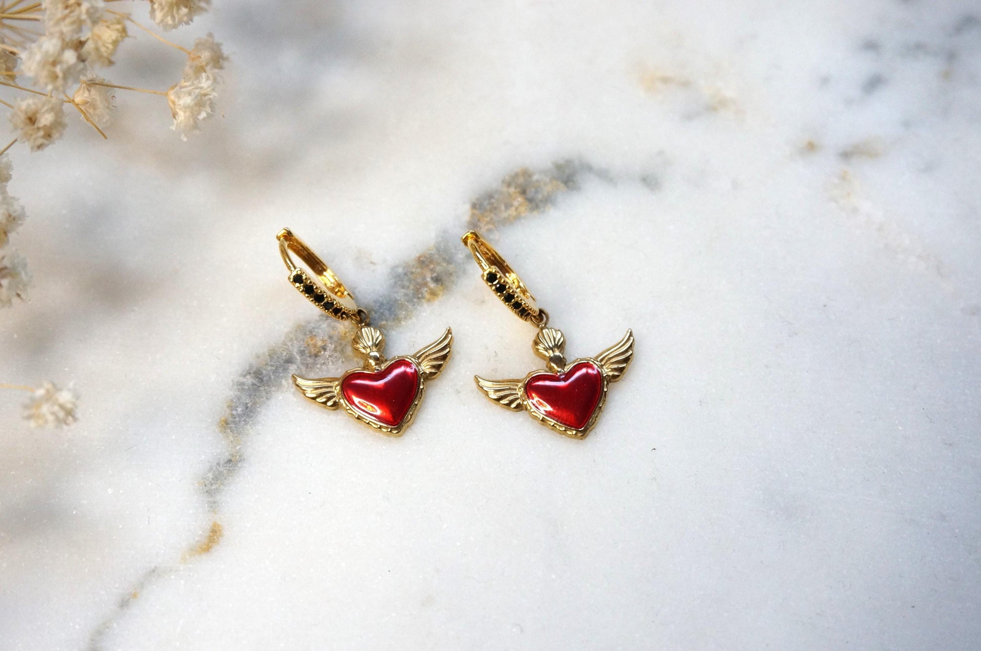 Winged sacred heart black studded hoops