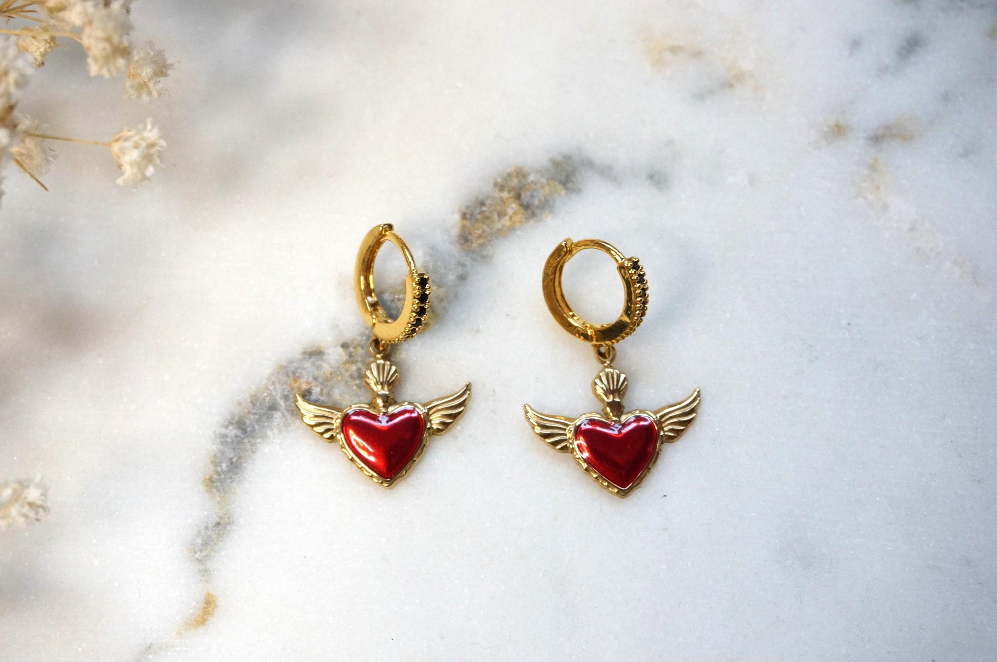 Winged sacred heart black studded hoops