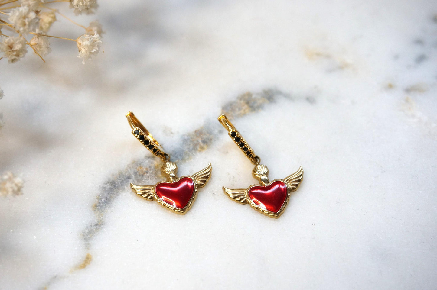Winged sacred heart black studded hoops