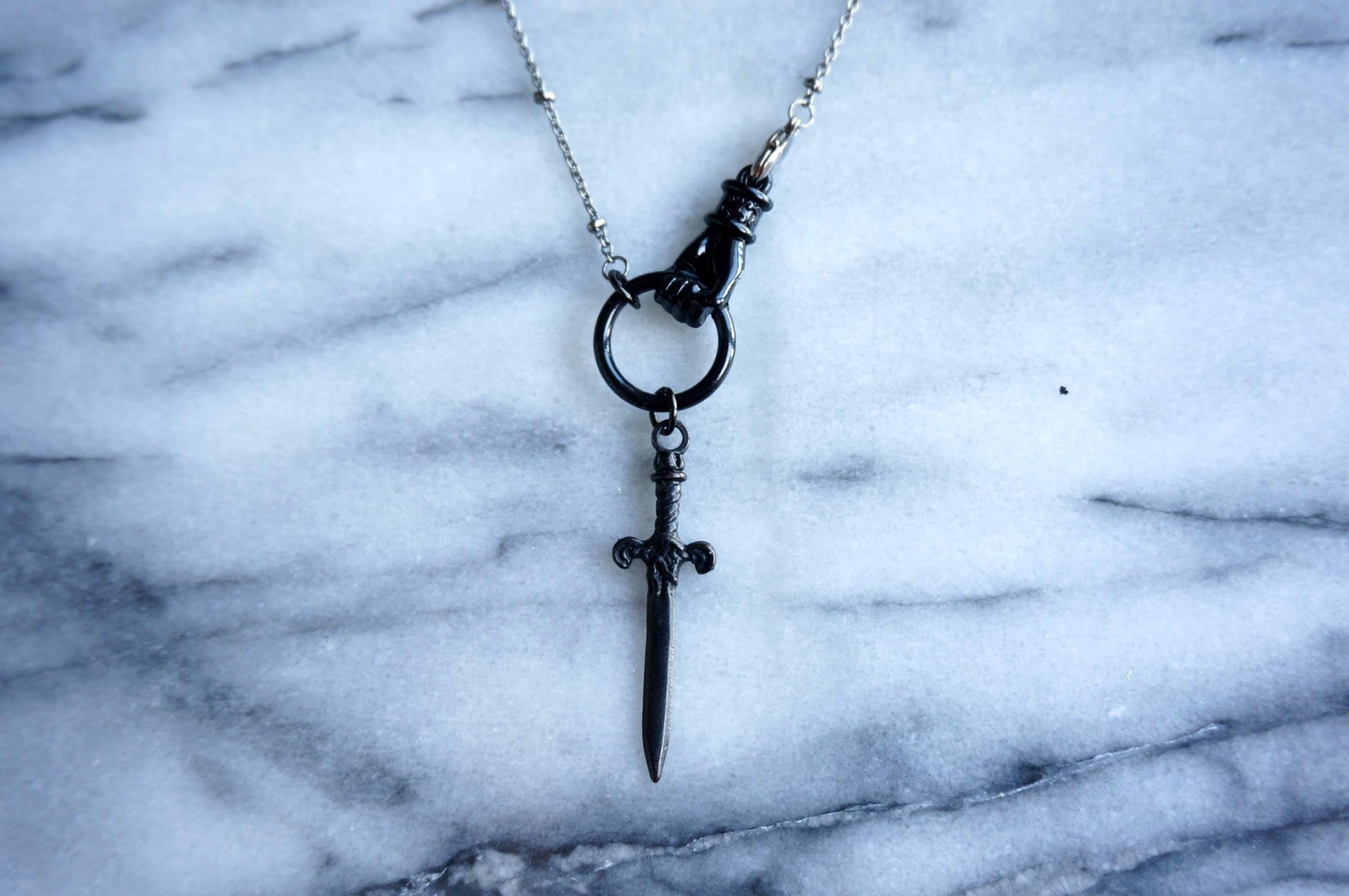 THE HAND Gold / Silver / Black hand and sword necklace / Gold / Silver / Black sword statement necklace