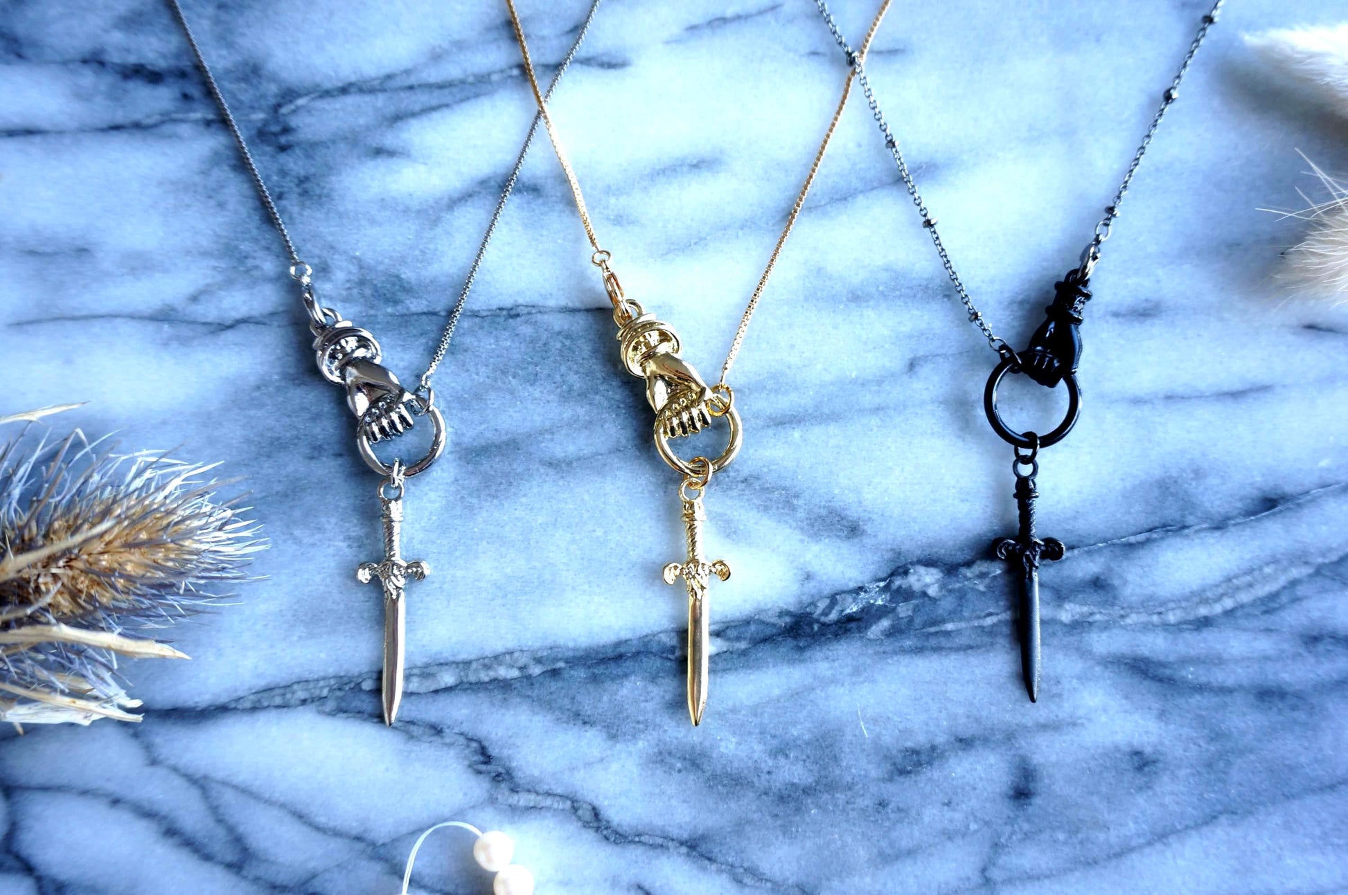 THE HAND Gold / Silver / Black hand and sword necklace / Gold / Silver / Black sword statement necklace