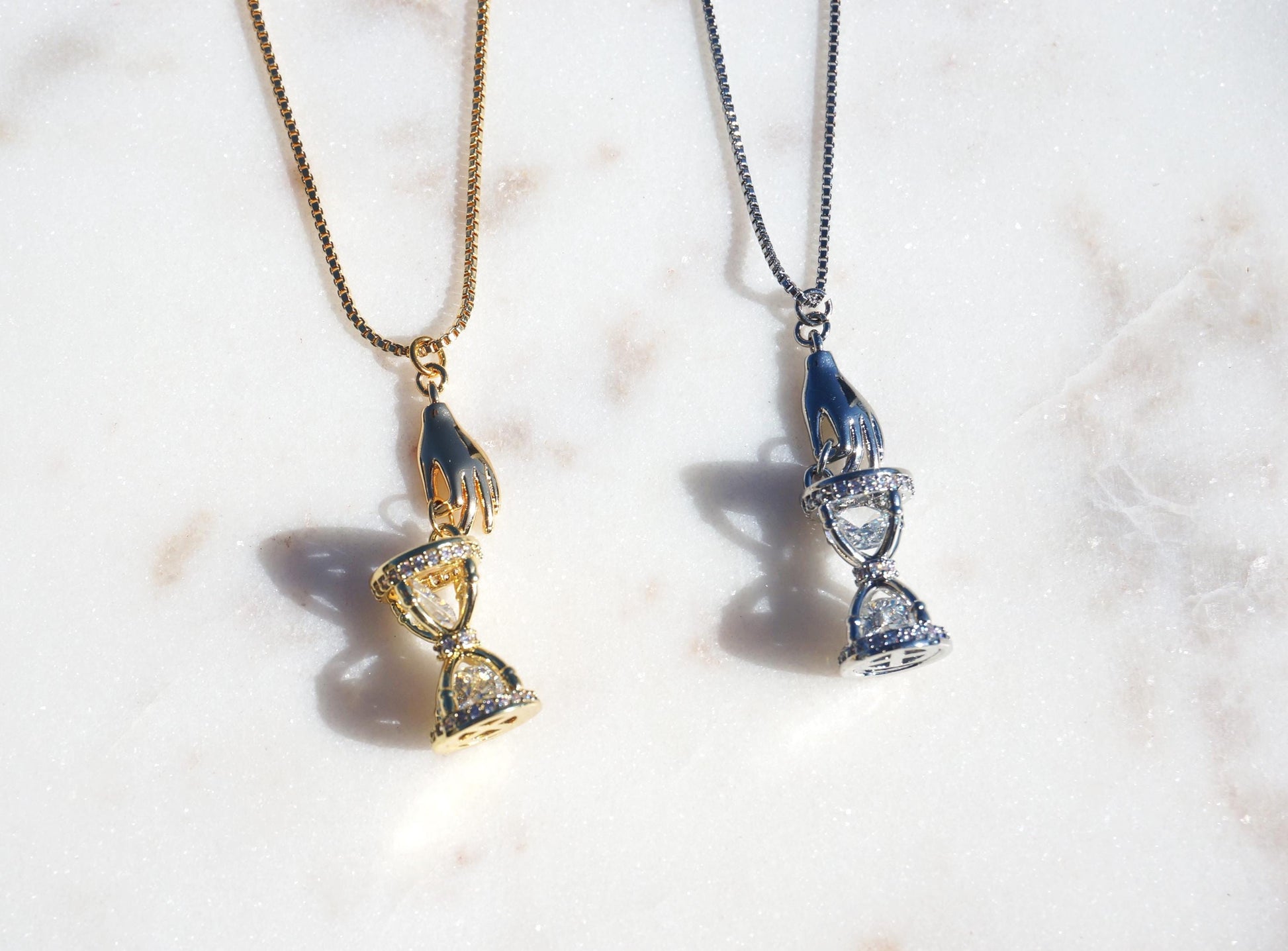 Gold/Silver Hand Holding Hourglass Necklace
