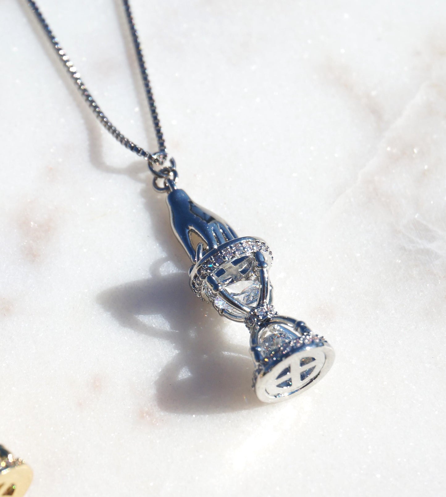 Gold/Silver Hand Holding Hourglass Necklace