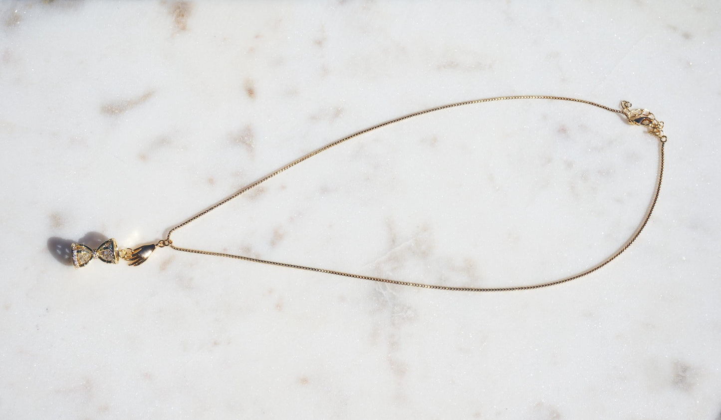 Gold/Silver Hand Holding Hourglass Necklace