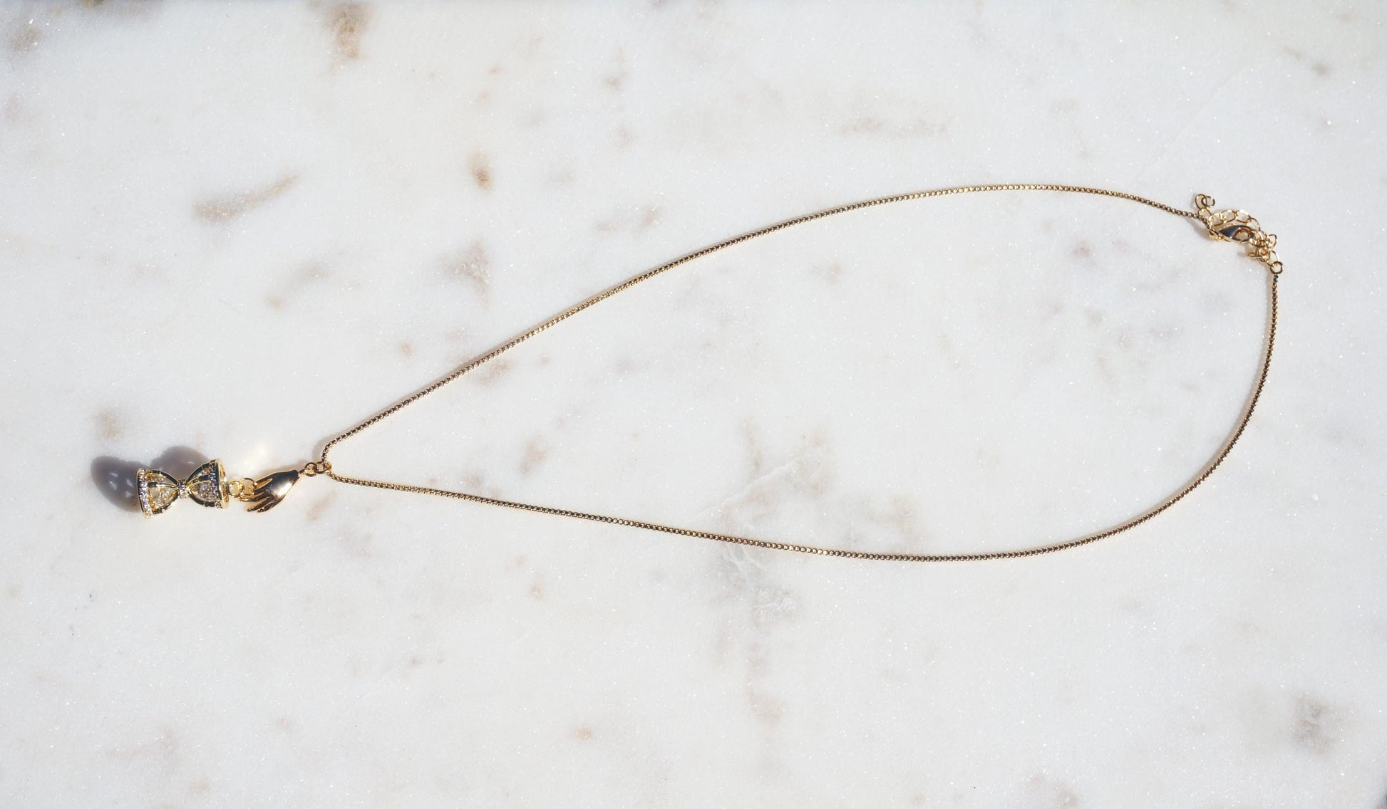 Gold/Silver Hand Holding Hourglass Necklace