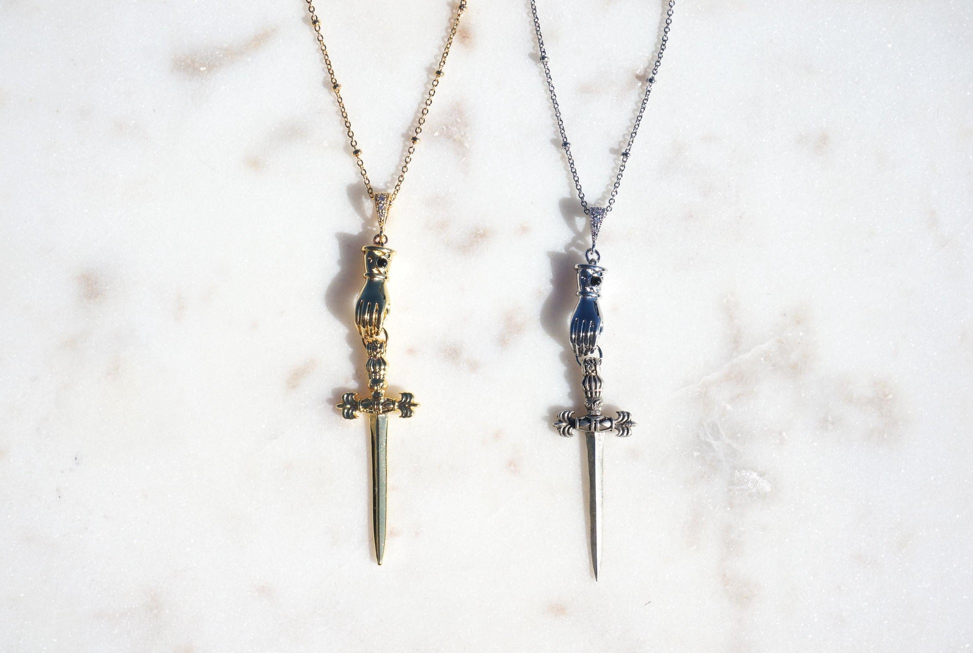 Gold/Silver Gauntlet Holding Gladius Sword Necklace