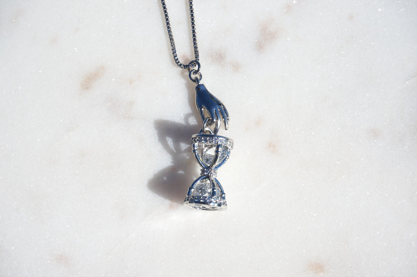 Gold/Silver Hand Holding Hourglass Necklace