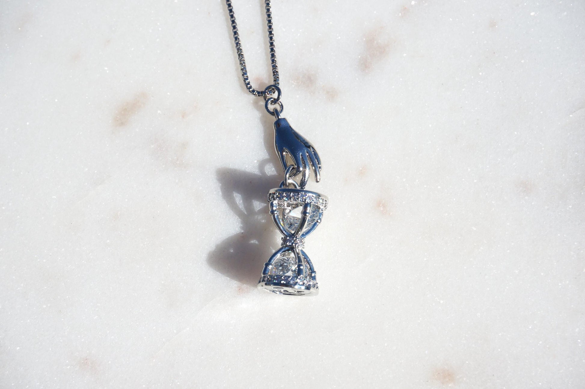 Gold/Silver Hand Holding Hourglass Necklace