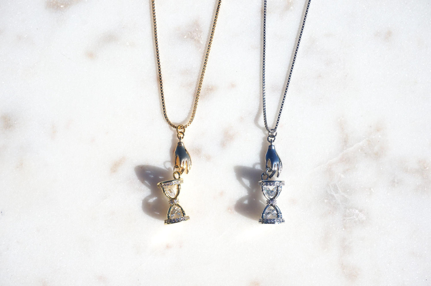 Gold/Silver Hand Holding Hourglass Necklace