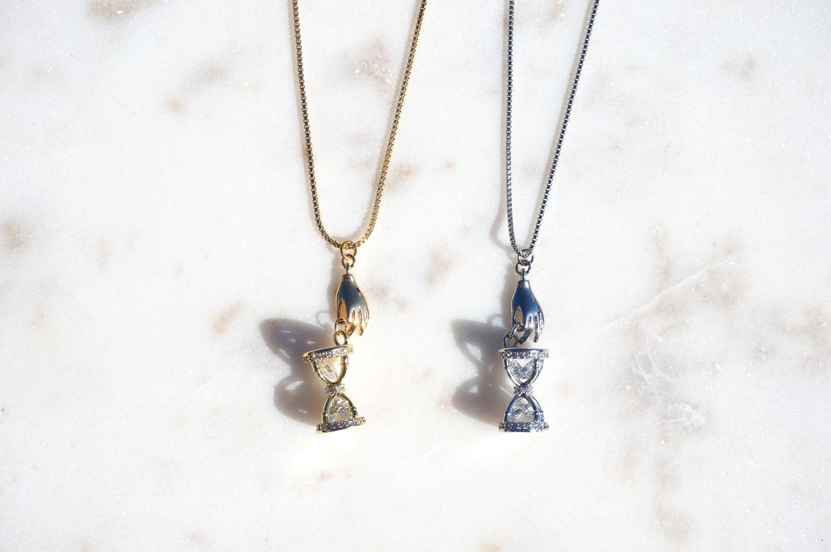 Gold/Silver Hand Holding Hourglass Necklace