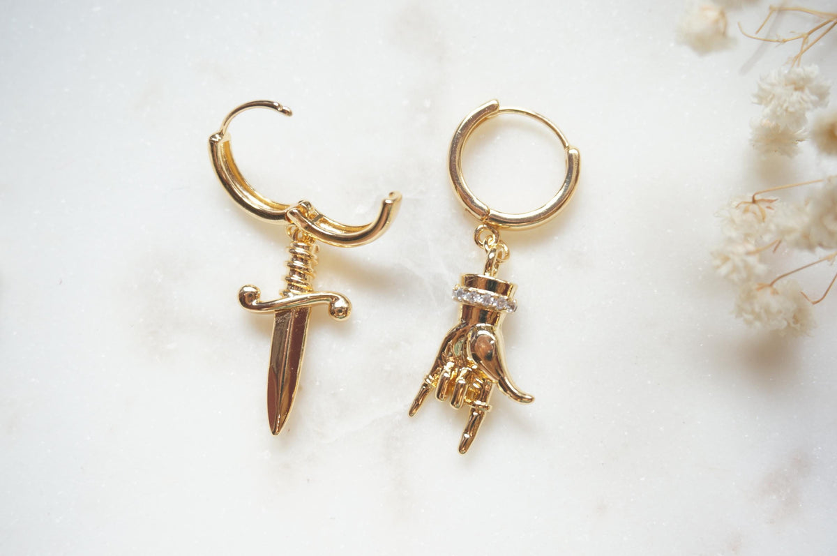 MELANGE Hand and Dagger Mismatched Hoop Earrings