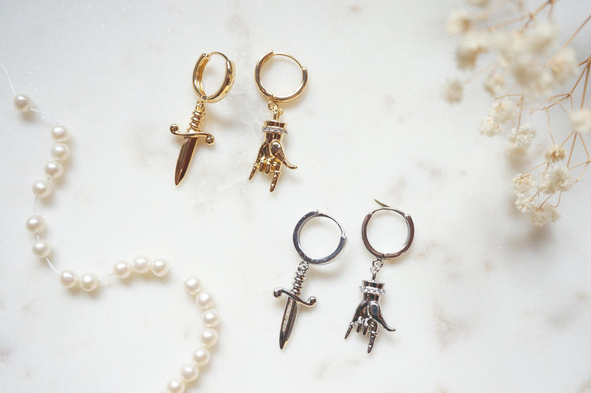 MELANGE Hand and Dagger Mismatched Hoop Earrings