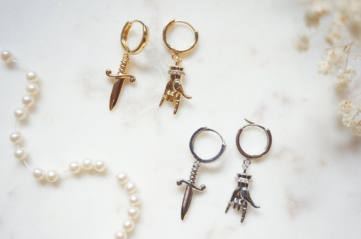 MELANGE Hand and Dagger Mismatched Hoop Earrings