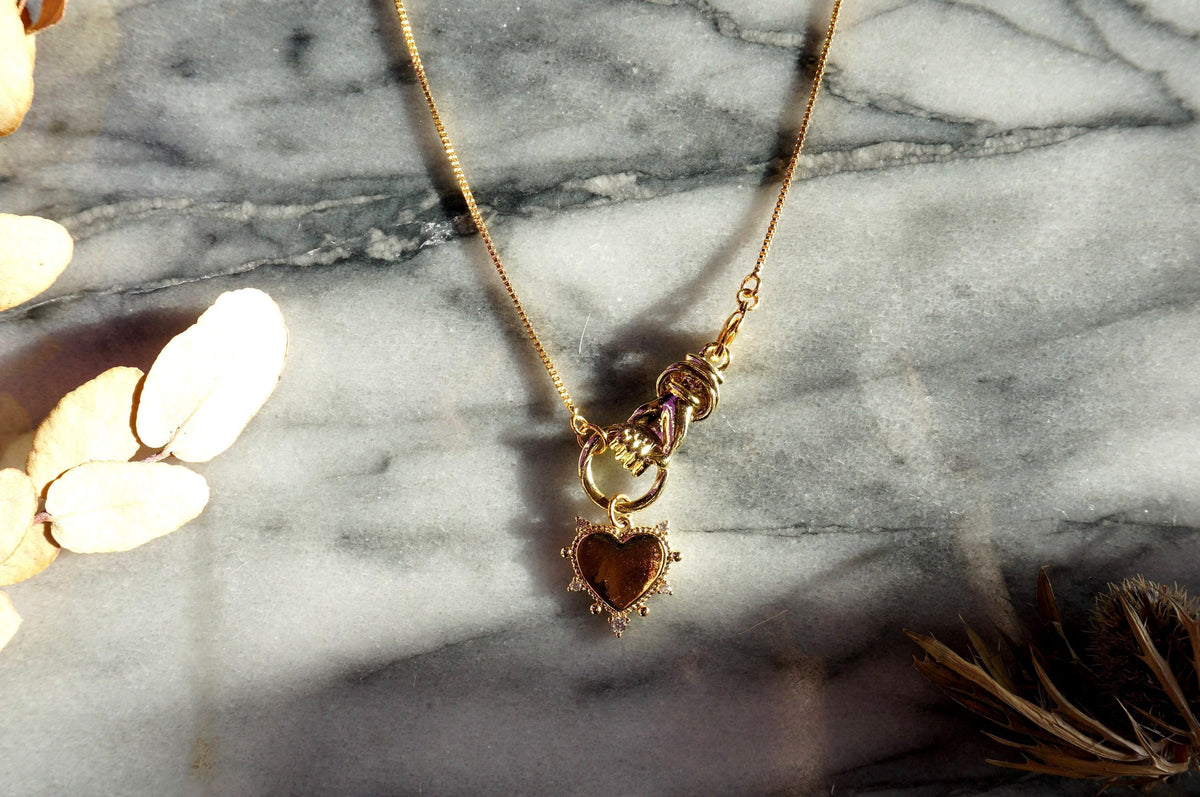 Hand holding Heart Gold / Silver Necklace