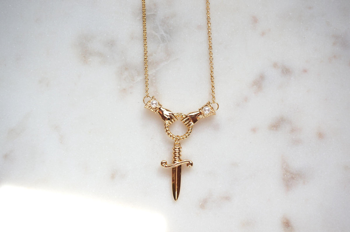 TEMPEST Hands Holding Dirk Sword Necklace
