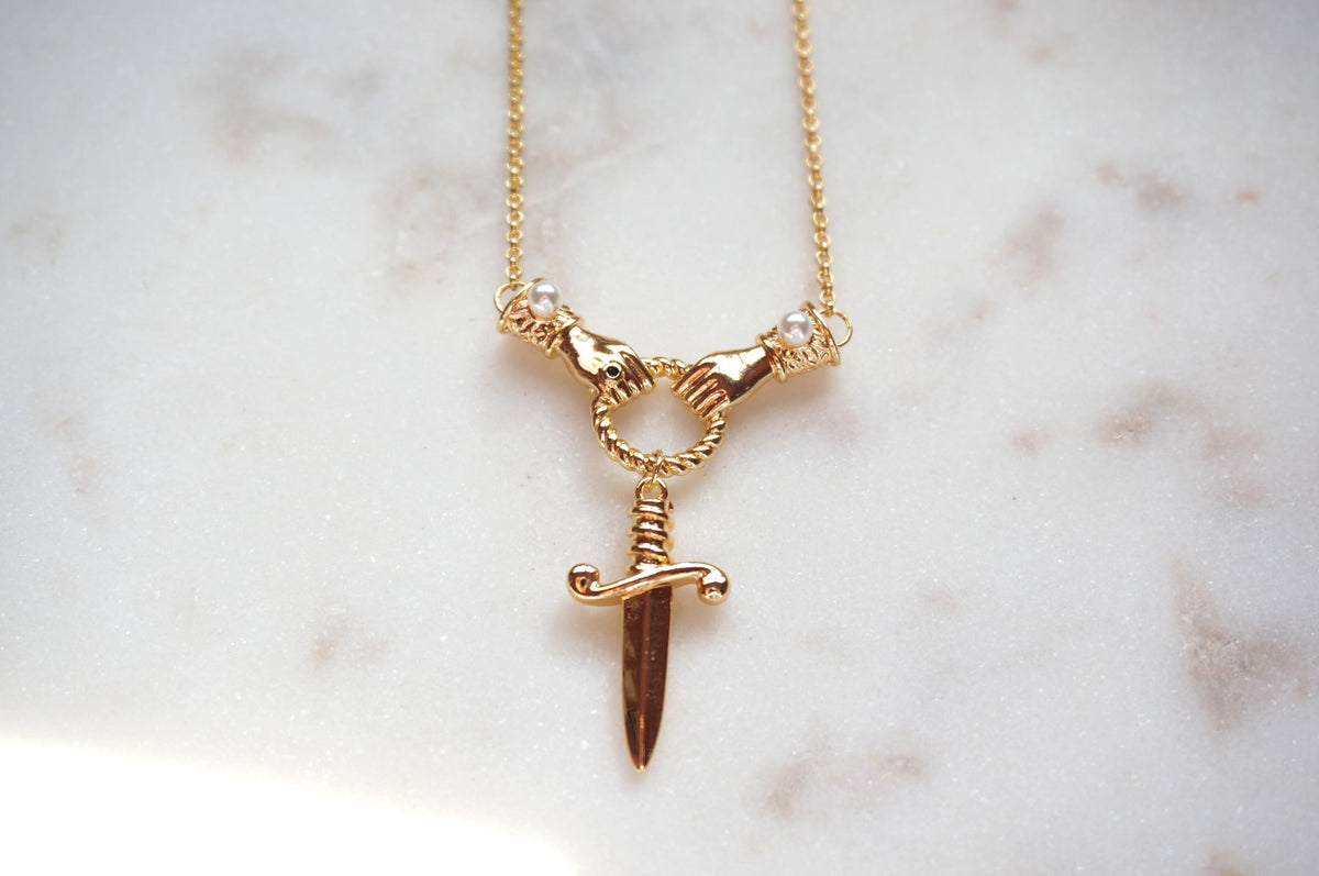TEMPEST Hands Holding Dirk Sword Necklace