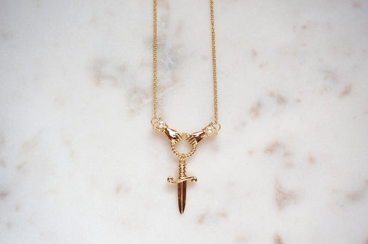 TEMPEST Hands Holding Dirk Sword Necklace