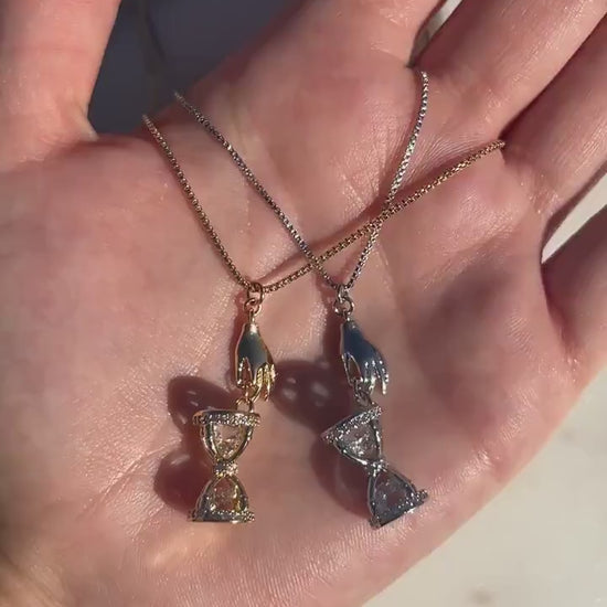 Gold/Silver Hand Holding Hourglass Necklace