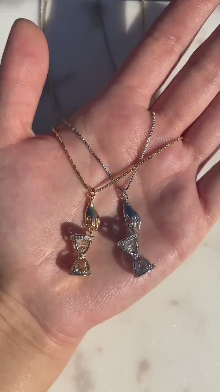 Gold/Silver Hand Holding Hourglass Necklace