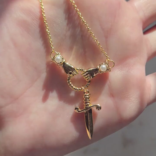 TEMPEST Hands Holding Dirk Sword Necklace