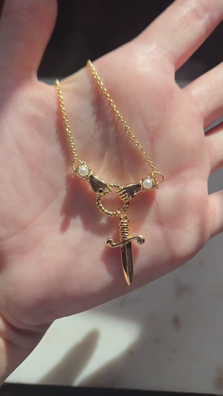 TEMPEST Hands Holding Dirk Sword Necklace
